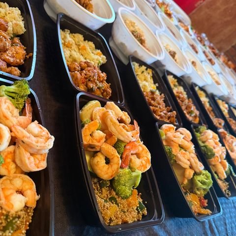 Buffet-style catering trays arranged for a Kansas City celebration